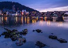 The Old Town of Heidelberg with the Old Bridge, river Neckar and the Bridge Gate. Image taken from public ground. Blue hour. Germany.